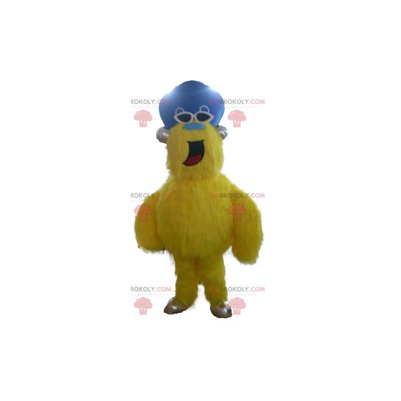 All hairy yellow monster mascot with a hat - Redbrokoly.com