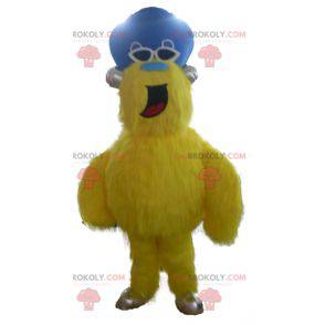 All hairy yellow monster mascot with a hat - Redbrokoly.com