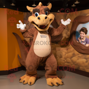 Brown Dragon mascot costume character dressed with a Mom Jeans and Gloves