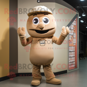 Tan Candy mascot costume character dressed with a Bodysuit and Caps