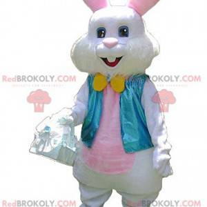 Mascotte coniglio bianco e rosa con un giubbotto blu -