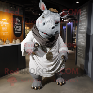 Silver Rhinoceros mascot costume character dressed with a Cargo Shorts and Shawl pins