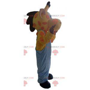 Mascotte de girafe jaune orange et rose en salopette -