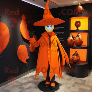 Orange Witch'S Hat mascot costume character dressed with a Blazer and Clutch bags