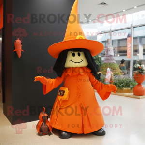 Orange Witch'S Hat mascot costume character dressed with a Blazer and Clutch bags