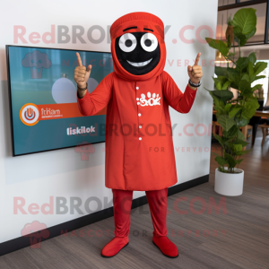Red Tikka Masala mascot costume character dressed with a Dress Pants and Smartwatches