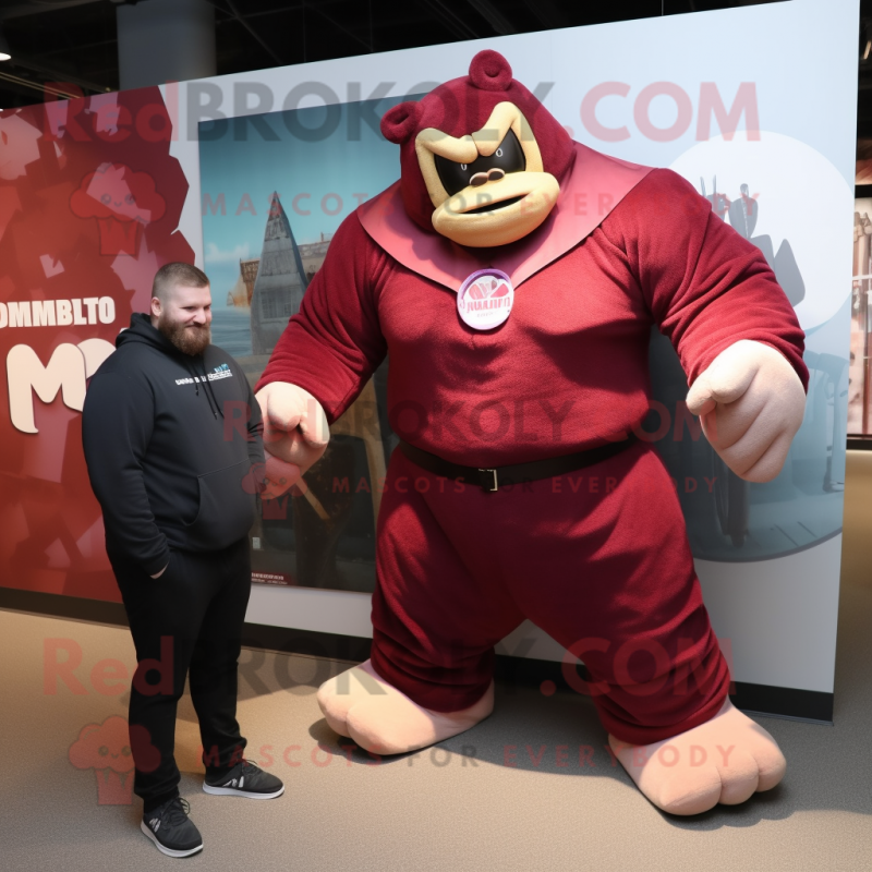Maroon Strongman mascot costume character dressed with a Cover-up and Watches Maroon Strongman mascot costume character dressed with a Cover-up and Watches