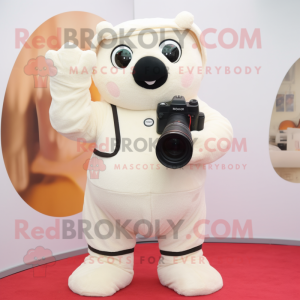 Cream Camera mascot costume character dressed with a Romper and Mittens