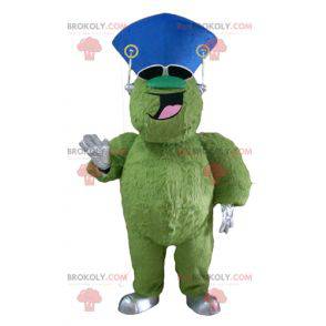 Very smiling hairy and plump green monster mascot -