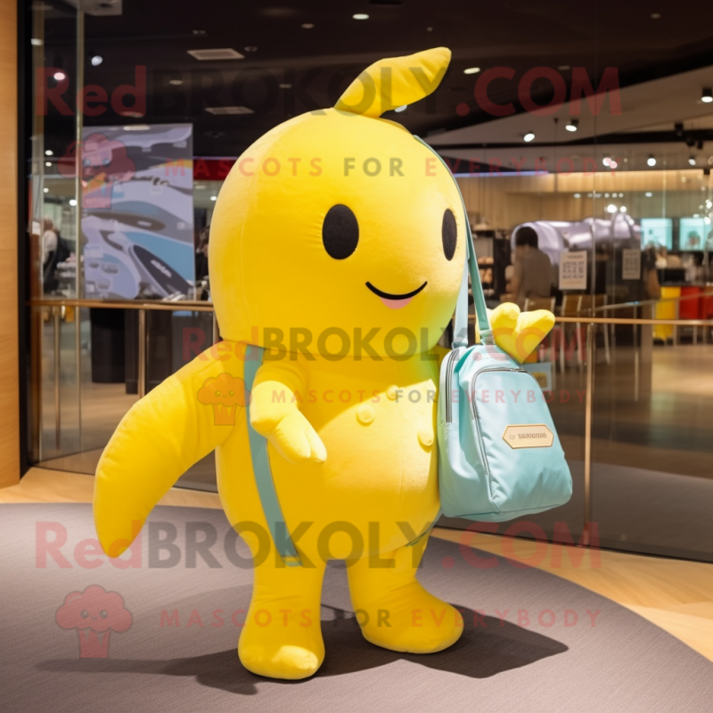 Lemon Yellow Narwhal mascot costume character dressed with a Jumpsuit and Handbags Lemon Yellow Narwhal mascot costume character dressed with a Jumpsuit and Handbags