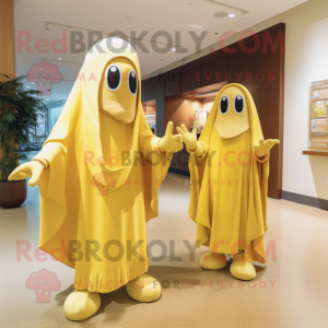 Gold Banana mascot costume character dressed with a Shift Dress and Shawls