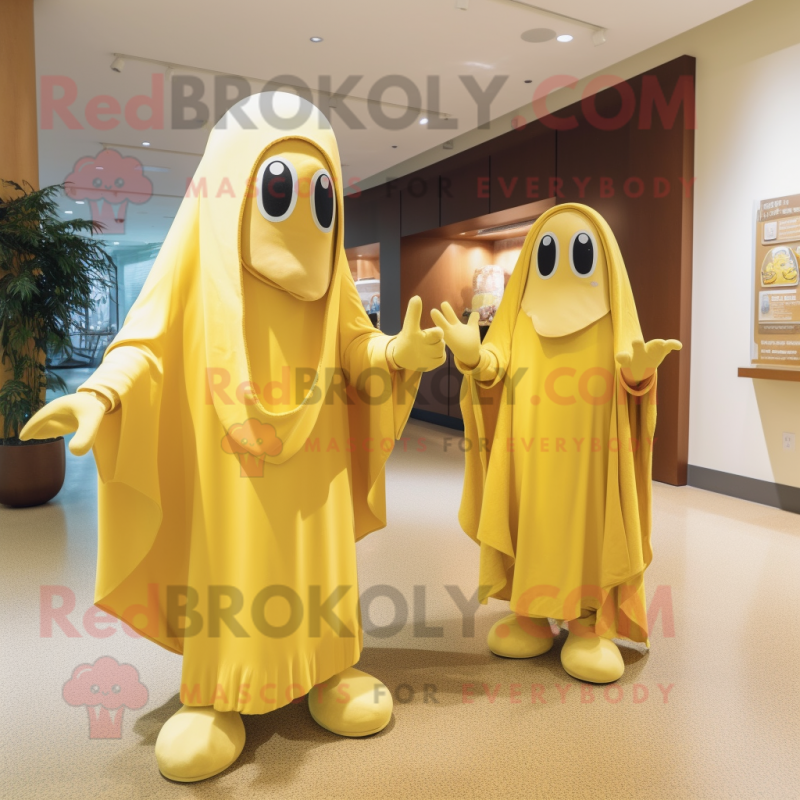 Gold Banana mascot costume character dressed with a Shift Dress and Shawls Gold Banana mascot costume character dressed with a Shift Dress and Shawls