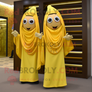 Gold Banana mascot costume character dressed with a Shift Dress and Shawls