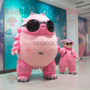 Pink Glyptodon mascot costume character dressed with a Romper and Sunglasses