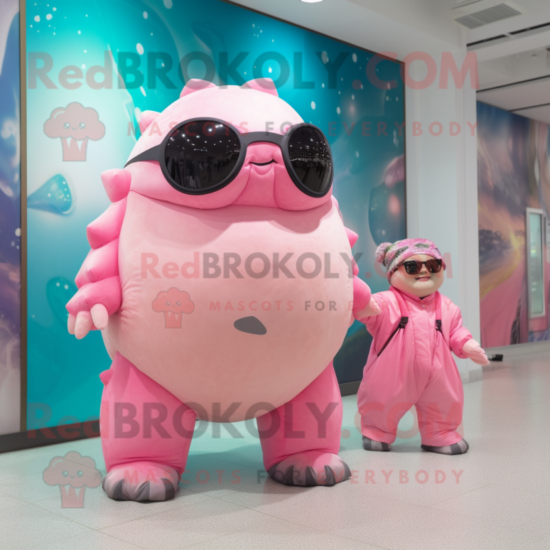 Pink Glyptodon mascot costume character dressed with a Romper and Sunglasses Pink Glyptodon mascot costume character dressed with a Romper and Sunglasses