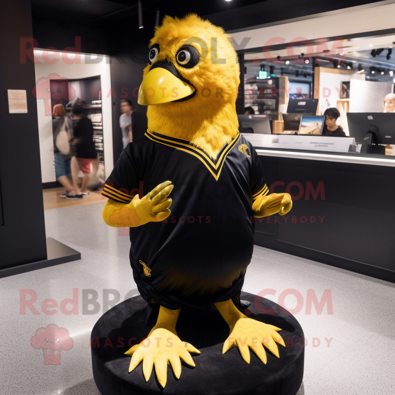 Gold Blackbird mascot costume character dressed with a V-Neck Tee and Hair clips Gold Blackbird mascot costume character dressed with a V-Neck Tee and Hair clips