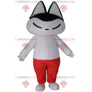 Black and white cat mascot in white and red outfit -