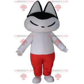 Mascote gato preto e branco em roupa branca e vermelha -