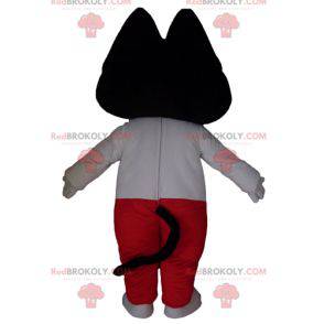 Black and white cat mascot in white and red outfit -