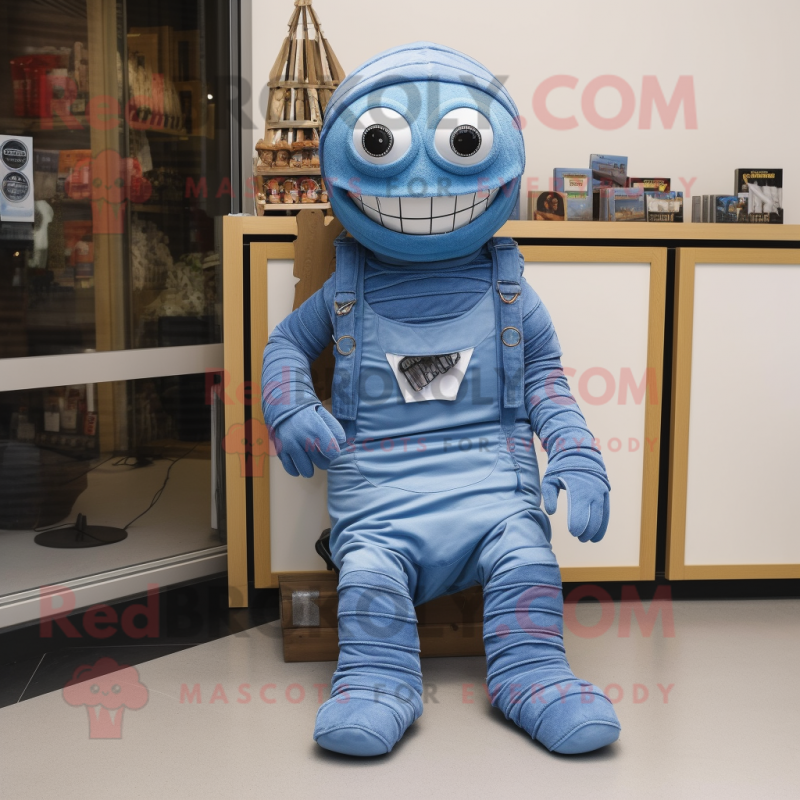 Blue Mummy mascot costume character dressed with a Overalls and Shoe clips