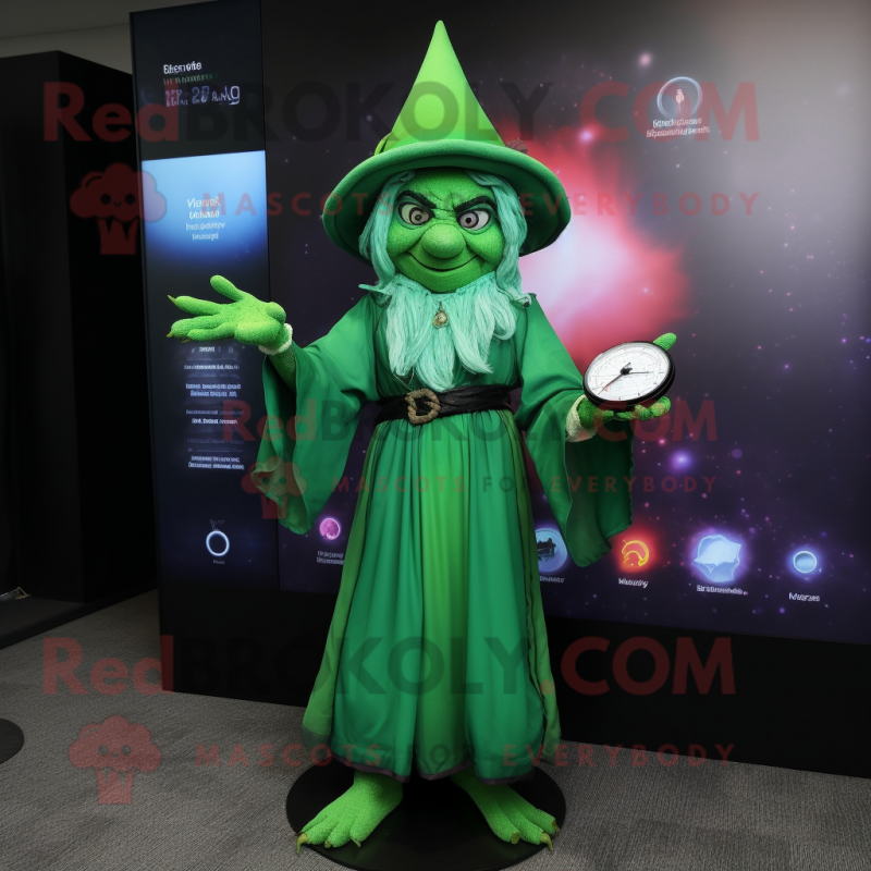 Green Witch mascot costume character dressed with a Shift Dress and Digital watches Green Witch mascot costume character dressed with a Shift Dress and Digital watches