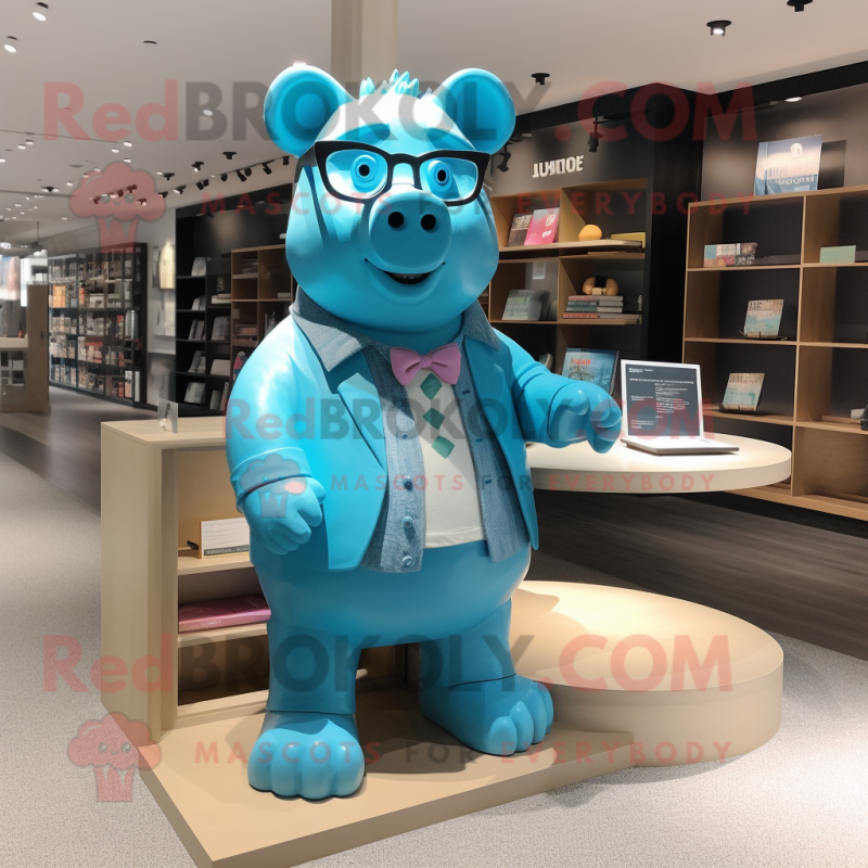 Blue Pig mascot costume character dressed with a Graphic Tee and Reading glasses