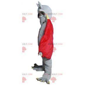 Mascota del diablo murciélago gris con una capa roja -