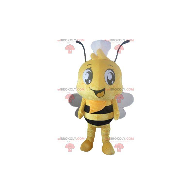 Mascote abelha amarela e preta com um toque na cabeça -