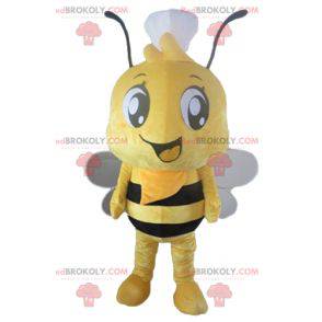 Mascote abelha amarela e preta com um toque na cabeça -