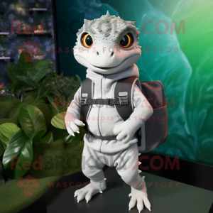 Silver Geckos mascot costume character dressed with a Sweater and Backpacks