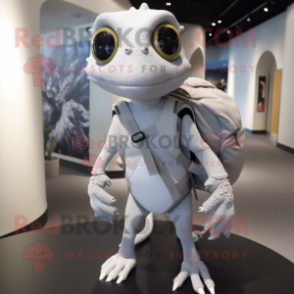 Silver Geckos mascot costume character dressed with a Sweater and Backpacks