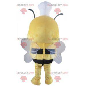 Mascotte d'abeille jaune et noire avec une toque sur la tête -