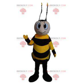 Mascota abeja amarilla y negra sonriente - Redbrokoly.com