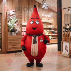 Red Pear mascot costume character dressed with a Waistcoat and Shoe laces