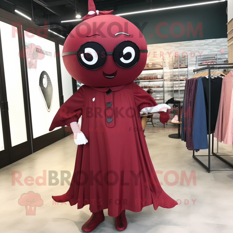 Maroon Narwhal mascot costume character dressed with a Dress and Eyeglasses Maroon Narwhal mascot costume character dressed with a Dress and Eyeglasses