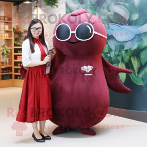 Maroon Narwhal mascot costume character dressed with a Dress and Eyeglasses