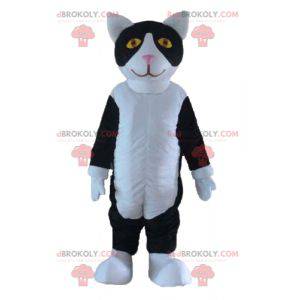 Mascote gato preto e branco com olhos amarelos - Redbrokoly.com