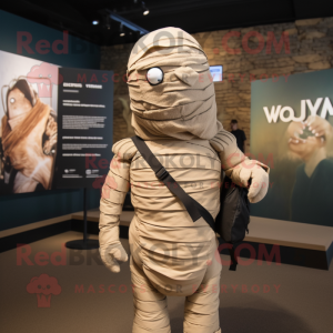 Olive Mummy mascot costume character dressed with a V-Neck Tee and Backpacks