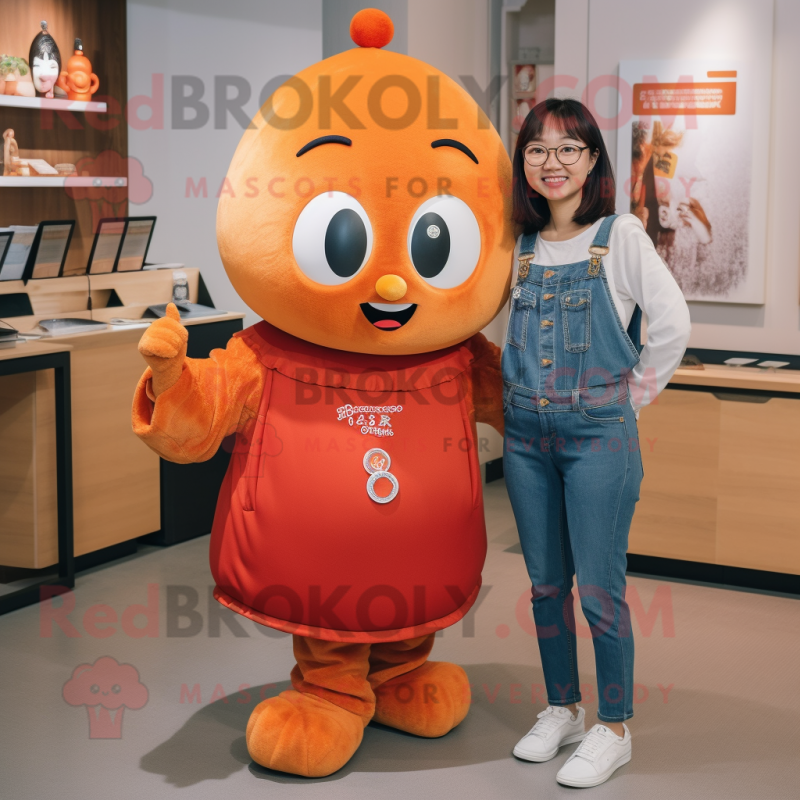 Rust Mandarin mascot costume character dressed with a Mom Jeans and Earrings