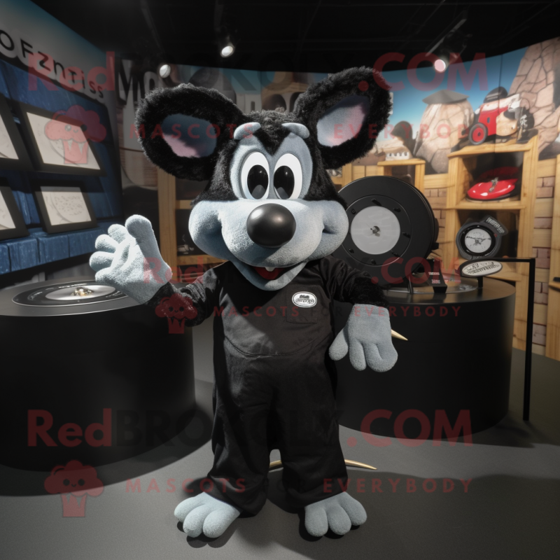 Black Ray mascot costume character dressed with a Dungarees and Rings Black Ray mascot costume character dressed with a Dungarees and Rings