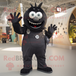 Black Ray mascot costume character dressed with a Dungarees and Rings