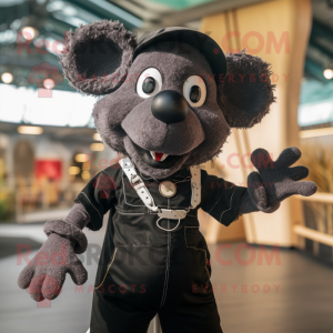 Black Ray mascot costume character dressed with a Dungarees and Rings