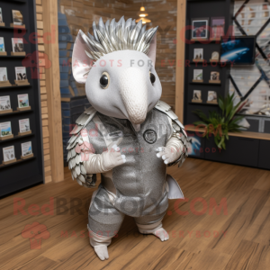 Silver Armadillo mascot costume character dressed with a Oxford Shirt and Keychains