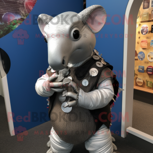 Silver Armadillo mascot costume character dressed with a Oxford Shirt and Keychains