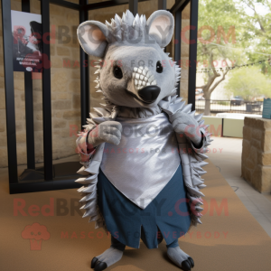 Silver Armadillo mascot costume character dressed with a Oxford Shirt and Keychains