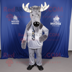 Silver Moose mascot costume character dressed with a Sheath Dress and Tie pins