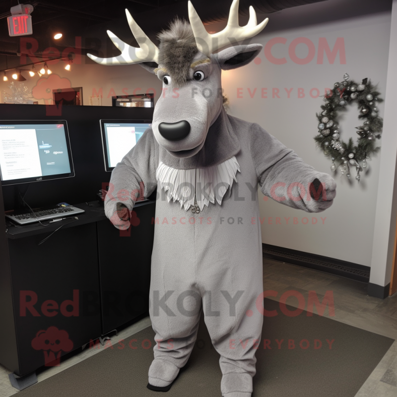Silver Moose mascot costume character dressed with a Sheath Dress and Tie pins Silver Moose mascot costume character dressed with a Sheath Dress and Tie pins
