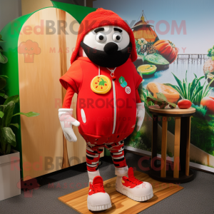 Red Tomato mascot costume character dressed with a Board Shorts and Beanies