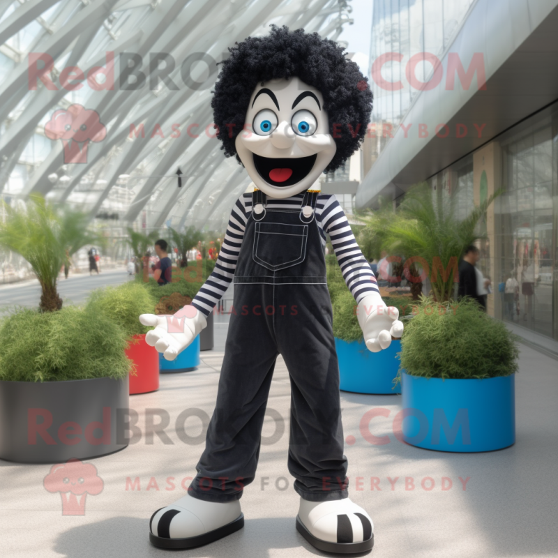 Black Mime mascot costume character dressed with a Flare Jeans and Shoe laces