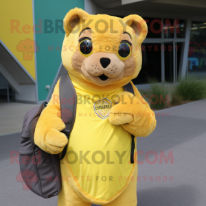 Lemon Yellow Jaguarundi mascot costume character dressed with a Cover-up and Backpacks